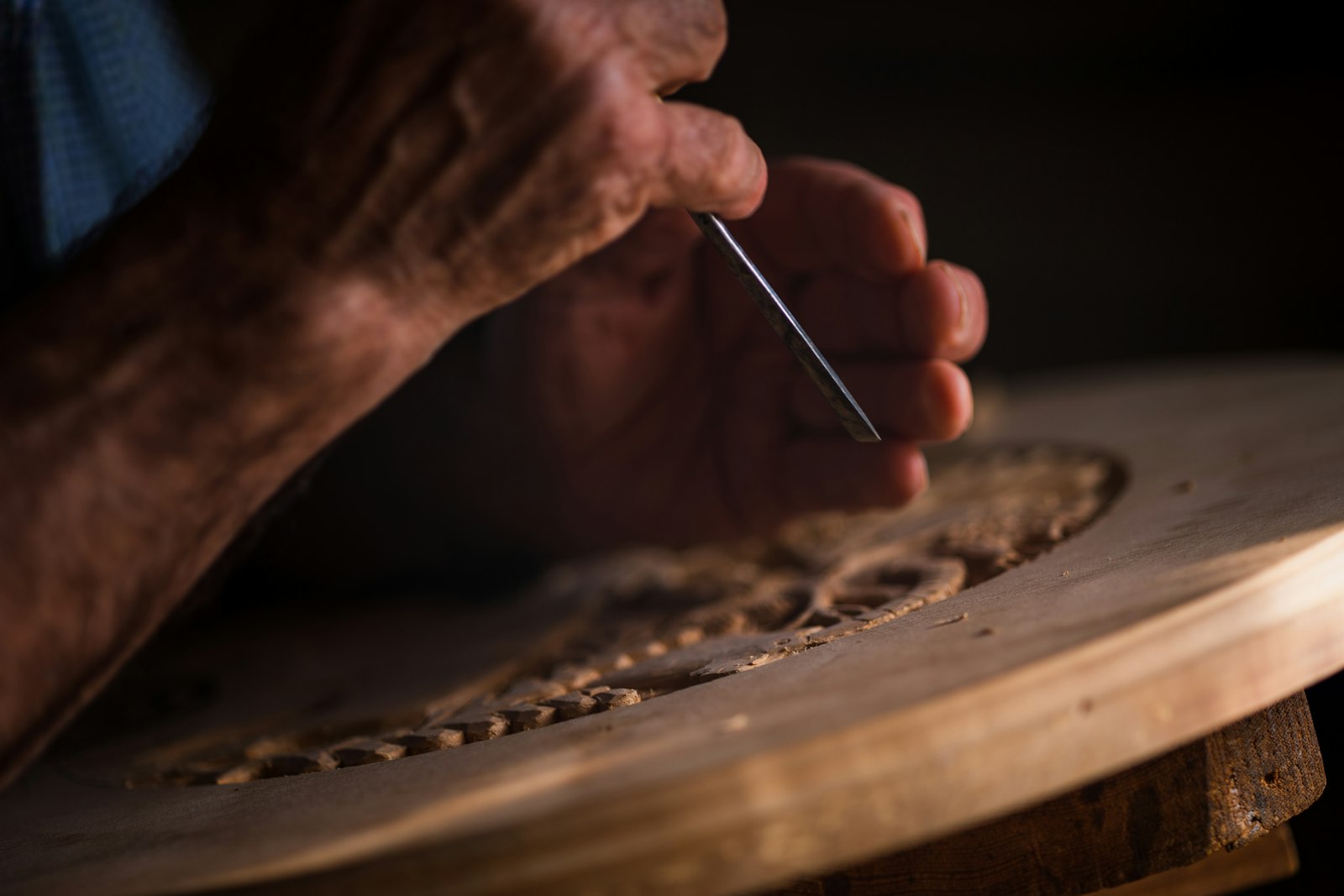 A person cutting a piece of wood, building something new. Photo by Alex Gruber on Unsplash, used under the free Unsplash License.